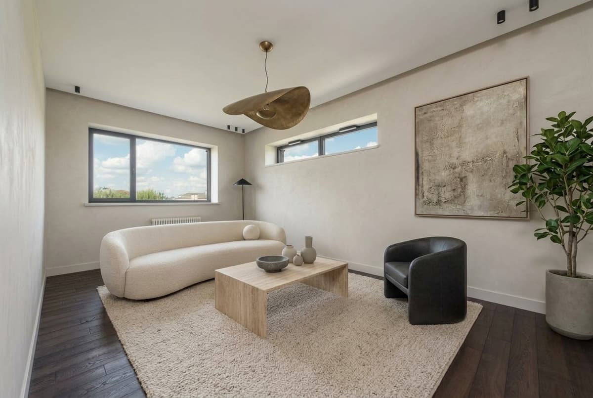 After: Virtual staging results — empty modern room staged in luxury contemporary style with bouclé sofa